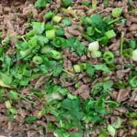 Larb Beef Salad (Thai Lettuce Wraps) · Minced beef and tripe mixed with lime juice, toasted rice, green onion, cilantro and chili s...