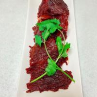Thai / Lao Beef Jerky  · Marinated beef overnight with our uni(que recipe, dehydrated  and deep fried.