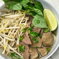 Beef Pho Noodle Soup · Rice noodle, steak and meatball in beef broth topped with green onion, cilantro