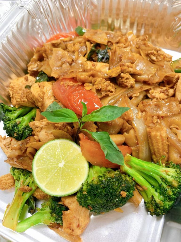 Drunken Noodle Chicken  · Pan fried flat rice noodle with sweet chili sauce, eggs, onion, bell pepper, broccoli, tomato, baby corn and thai basil.