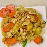 Pineapple Fried Rice Chicken · Thai jasmine rice stir fried with pineapple, carrot, onion, green onion, cashew and raisin i...
