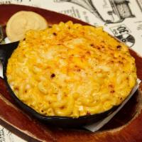 Mac ‘N Cheese · Baked in a cast iron skillet. Served with a side of corn bread.