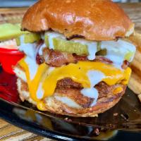 The Rancher · Crispy fried chicken, thick cut apple smoked bacon, ranch dressing, vermont cheddar and pick...