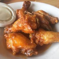 Chicken Wings · Deep fried and tossed with your choice of lemon pepper, spicy Buffalo, sweet teriyaki, or sp...