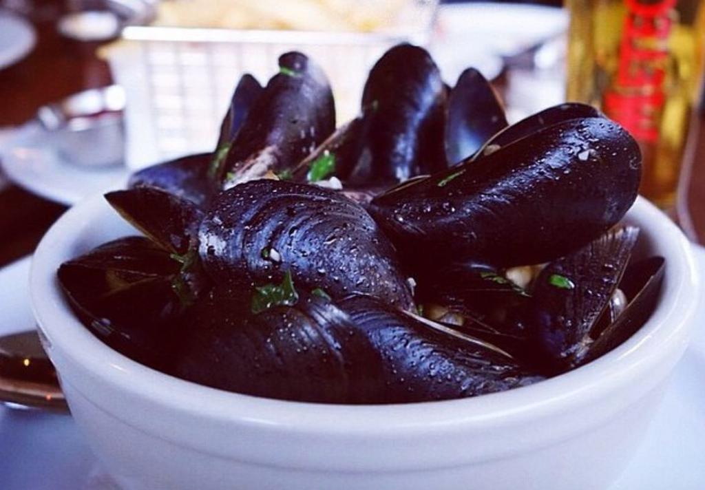 P.E.I. Mussels · White wine, shallots, tarragon, thyme, served with fries
