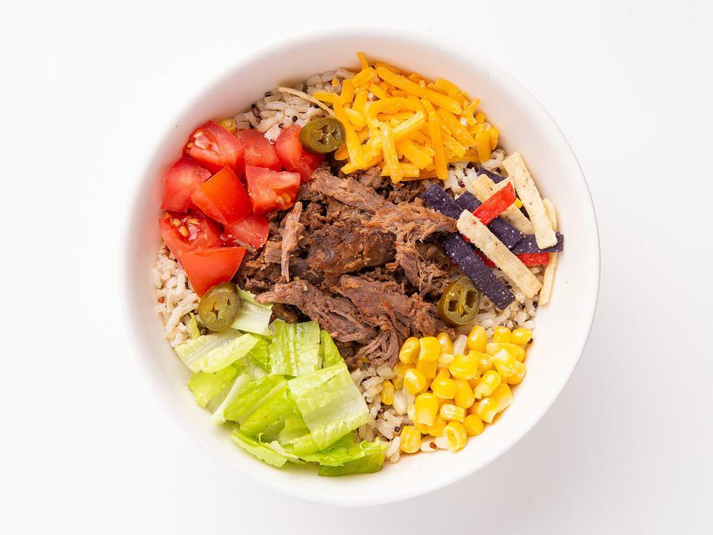 Beef Taco Fiesta Warm Grain Bowl · Say Ole’ to the Fiesta:  super grains blend, radiatore pasta, warmed braised beef, diced tomatoes, cheddar cheese, jalapenos, sweet corn, tri-color tortilla strips, topped with salsa ranch dressing.