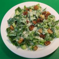 Caesar Salad · Romaine tossed in Caesar dressing with croutons and Parmesan.