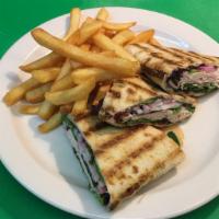 Turkey Avocado Panini · Sliced whole turkey, red onions, avocados, mixed greens and cranberry sauce.
