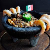 Molcajete Texano with Shrimp · Grilled chicken, steak and shrimp , onions and Mexican sausage mixed into a bowl with Mexica...