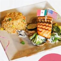 Salmon Hacienda Vieja · Grilled fresh salmon mixed with boiled broccoli, zucchini, mushrooms and bell peppers covere...