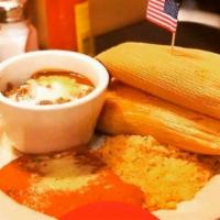 Tamale Dinner · 3 homemade chicken tamales served traditionally on the corn husk. Accompanied by rice, refri...