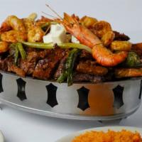 Parrilada Delicia Con Langostinos · Marinated skirt steak, fresh water large shrimp, grilled chicken, fresh rib tips, chorizo, p...