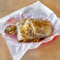 Machaca Burrito · Top sirloin shredded beef sauteed with bell peppers, onions, eggs, and cheese.