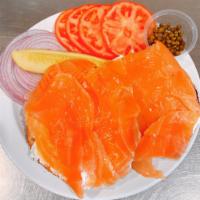 Bagel with Sliced Nova Platter · Sliced Nova lox, served open-faced on a bagel with sliced tomato, red onion, and capers on t...