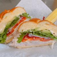 The San Francisco Sandwich · Roasted turkey sliced thin and topped with provolone cheese, fresh sliced avocado, shredded ...