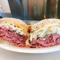 The Double Sandwich · Corned Beef & Pastrami, Topped with Swiss Cheesed, Homemade Cole Slaw, & Thousand Island Dre...