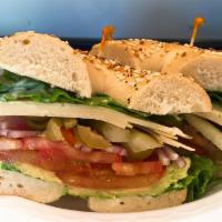 The Veggie Delight Sandwich · Fresh sliced avocado, tomato, red onion, pickle, sliced olives, shredded lettuce, Swiss chee...