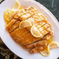 Lemon Chicken · Fried chicken filet with a sweet and tangy lemon sauce.