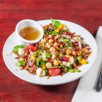 Tuscan Salad · Romaine hearts, cucumbers, garbanzo beans, diced bell peppers, red onion, bacon, cherry toma...