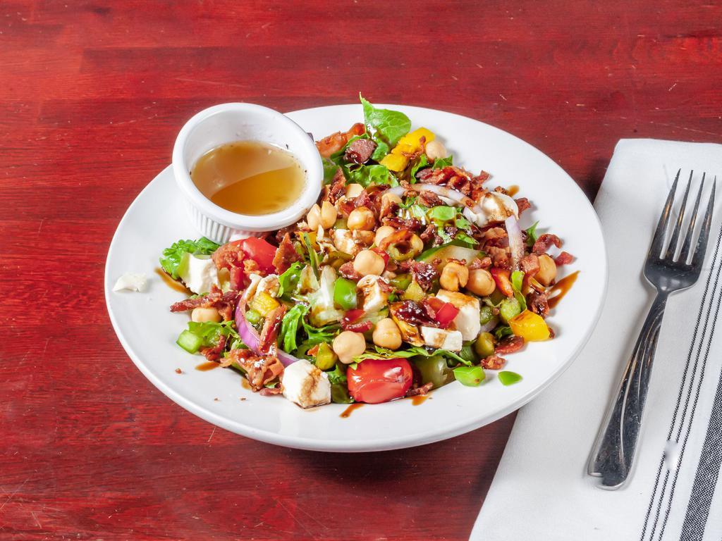 Tuscan Salad · Romaine hearts, cucumbers, garbanzo beans, diced bell peppers, red onion, bacon, cherry tomatoes and mozzarella cheese. Drizzled with balsamic glazed and served with red wine vinaigrette.
