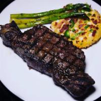 NY Strip Steak Dinner · 10oz NY Strip Steak served with onion rings and French fries with a side of mob sauce and st...
