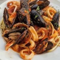 Seafood Pasta · Mussels, clamari, shrimps and salmon over pasta. Served over pasta with a side of bread.