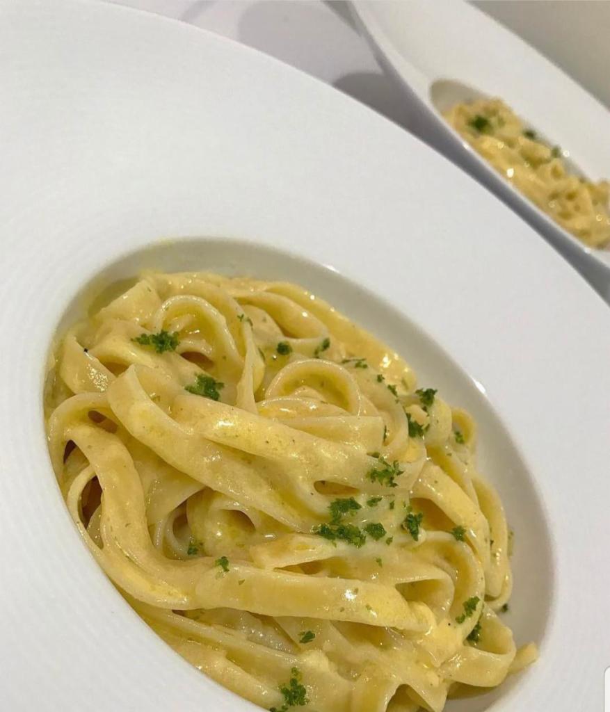Fettuccine Alfredo · Served with a side salad and bread.