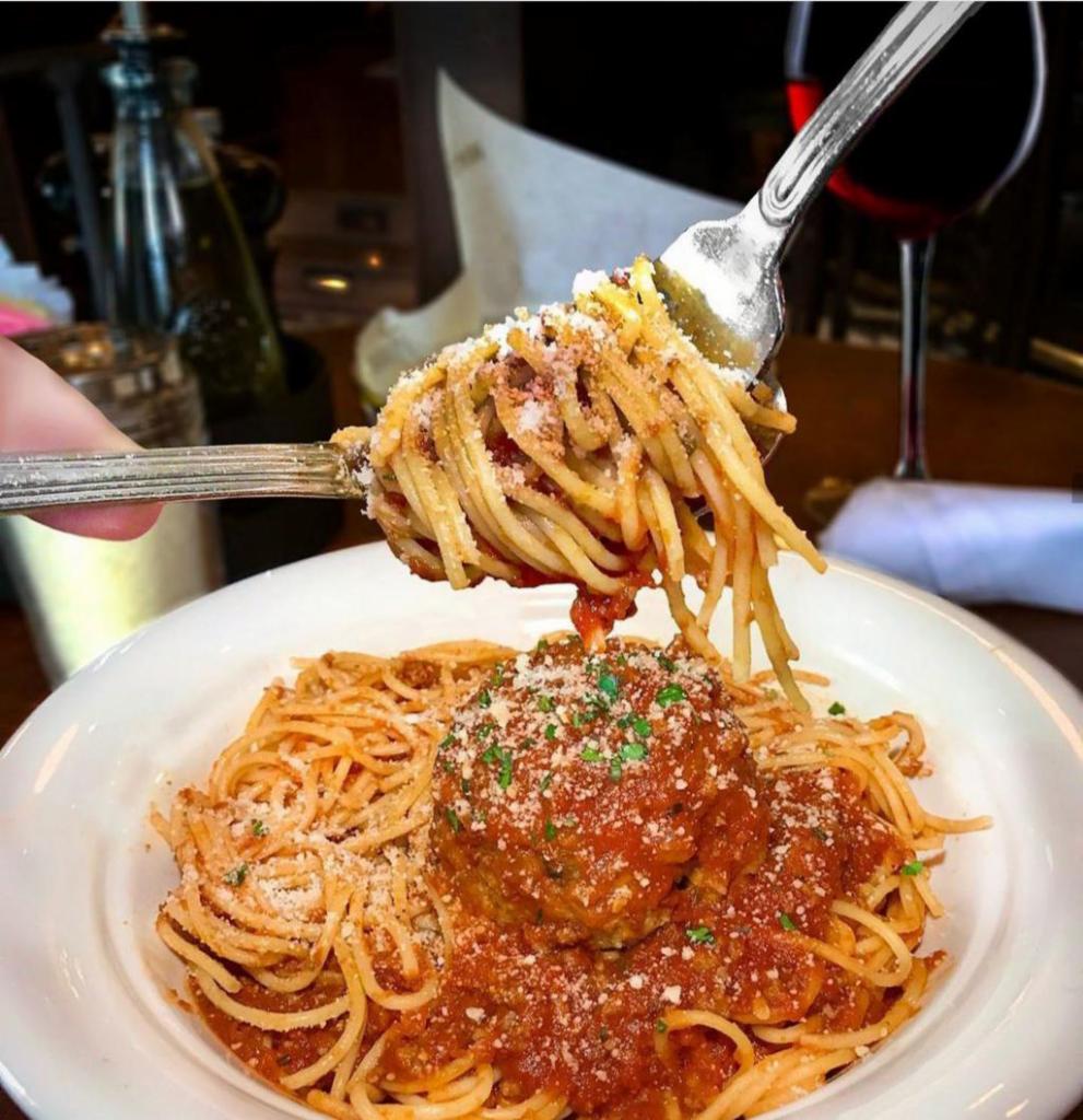 Spaghetti and Grandma Millie's Homemade Meatballs · Served with a side salad and bread.