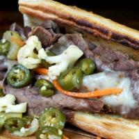 Italian Beef Sandwiches Combo · Housemade Italian beef, garlic au jus, choice of sweet peppers or giardiniera on french bread.