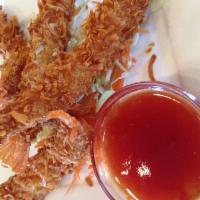 Coconut Shrimp · Crunchy coconut shrimp served with sweet & sour sauce.