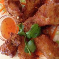 Chicken Wings · Fried chicken wings served with sweet&chili sauce.