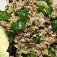 Larb · Minced chicken salad, seasoned with a mixture of roasted ground chili, roasted rice, lime dr...