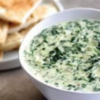 Borani Spinach · A smooth blend of sauteed spinach, onion and yogurt.