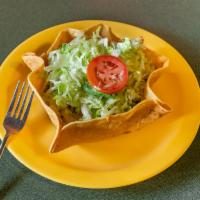 Taco Salad · Crispy flour tortilla, meat, beans, lettuce, tomato, cheese, salsa, sour cream and guacamole.