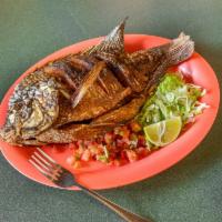Tilapia · Mojarra. Fish fried, served with rice and beans, lettuce, salsa, and choice of tortilla.