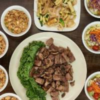 Filet Mignon Family Meal · Sautéed with our Benihana Original Garlic Sauce. Available for 2, 4 or 6! Served with, Benih...