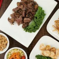 Filet Mignon & Scallops Family Meal · Filet sautéed with our Benihana Original Garlic Sauce and sea scallops grilled in lemon. Ava...