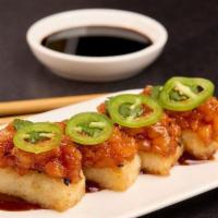 CRISPY SPICY RICE · Crunchy sesame rice balls, jalapeño, cilantro, drizzled with soy chili sauce