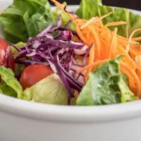 Benihana Salad · Crisp greens, red cabbage, carrots and grape tomatoes in a homemade tangy ginger dressing.