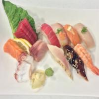 Sushi & Sashimi Combo · Three slices of tuna, two slices of each: salmon, octopus, yellowtail served with a piece of...