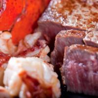 Deluxe Treat Special · Filet mignon and cold water lobster tail grilled with lemon.