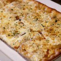Onofrio Special Square Pie · Thin crust grandma with fresh mozzarella, truffle oil, bread crumbs, and sauteed onions.