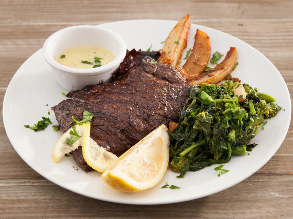 Skirt Steak · Charcoal grilled skirt steak. Served with cream of spinach and roasted potatoes.