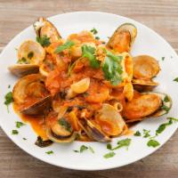 Seafood Marinara · Linguine with fresh mussels, calamari and shrimp.
