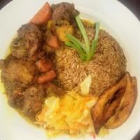 Curry Goat Platter · Served with rice and beans. Steamed cabbage and plantain.