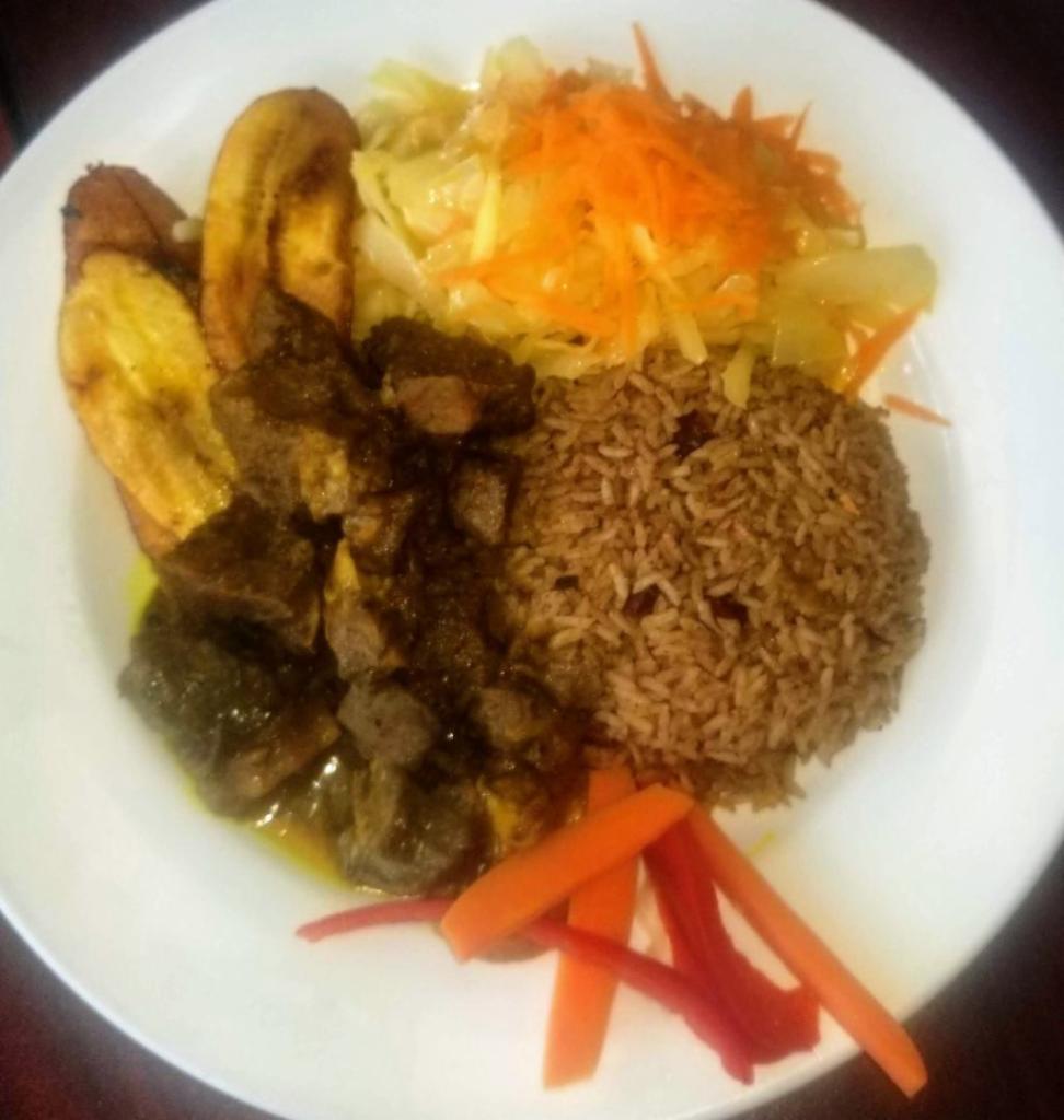 Chicken Curry Platter · Served with rice and beans. Steamed cabbage and plantain.
