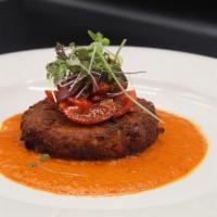 Maryland Crab Cake · Lump and Jumbo Crab Meat mixed with bread crumbs served with roasted peppers sauce.