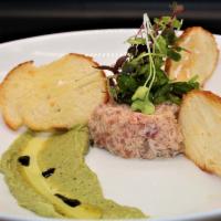 Tuna Tartare · Chopped raw tuna served with avocado cream and seaweed salad.