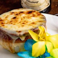 French Onion Soup · A beef stock soup with caramelized onions and a slice of garlic bread inside with mozzarella...