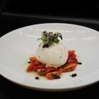 Burrata Salad · with Cherry tomatoes served with fresh basil, extra virgin olive oil, and aged balsamic.